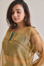 Front close up view of a banarsi teal and golden baggy and oversized 3 piece co-ord set with golden baggy fit kurta and striped slip