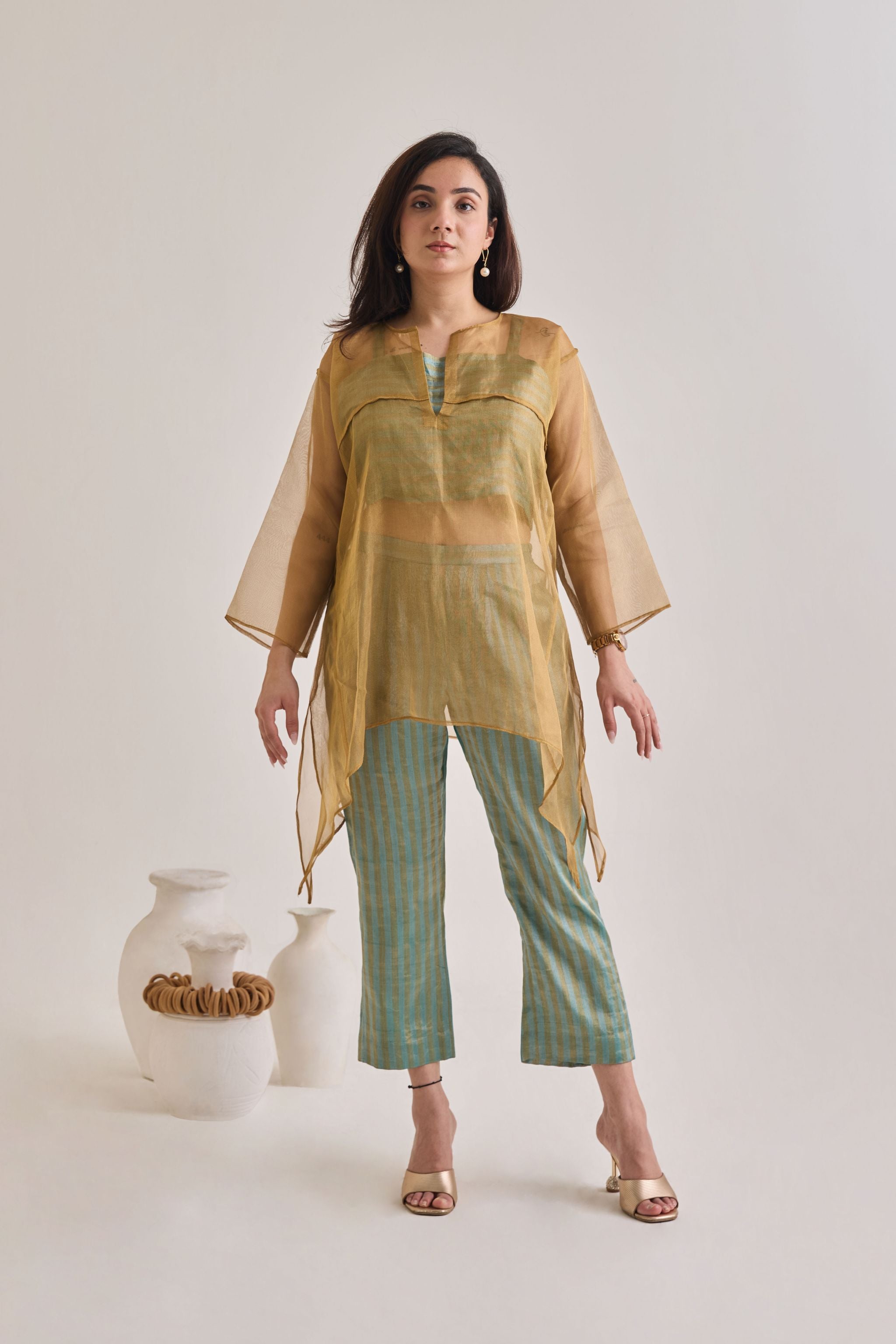 Front view of a banarsi teal and golden baggy and oversized 3 piece co-ord set with striped pants and slip