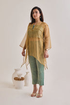 Side view of a banarsi teal and golden baggy and oversized 3 piece co-ord set with striped pants and slip