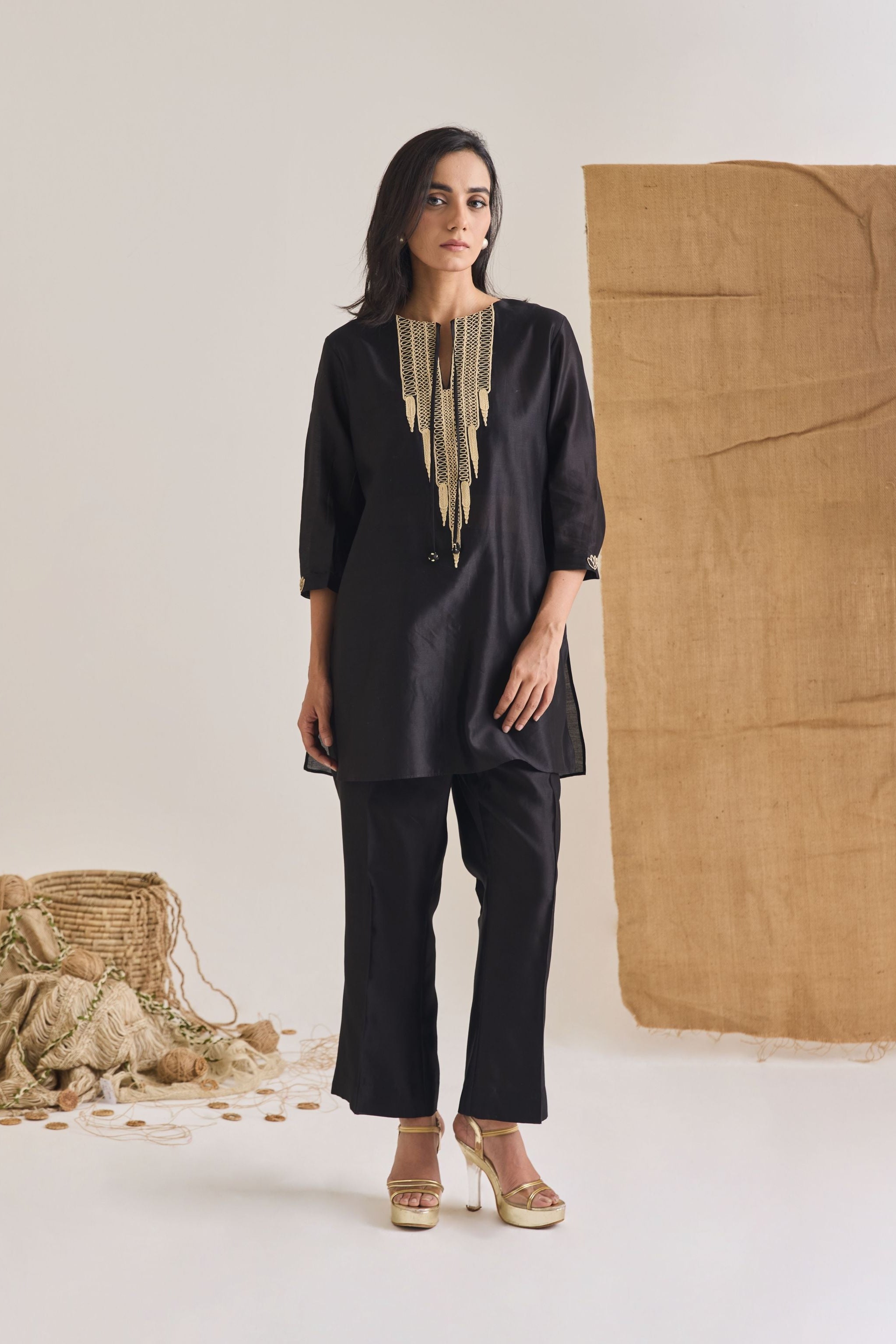 Front view of Black Chanderi short kurta with 3/4th sleeve and raw jute embroidery on neckline
