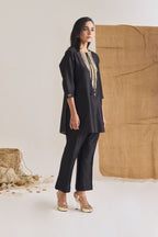 Side view of Black Chanderi short kurta with 3/4th sleeve and raw jute embroidery on neckline and front tie doris