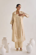 Front view of Chanderi set with a Long coat having notched collar, Fringed stripes Kurta and crease pants