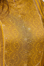 Close-up of Banarasi Kimkhab jacquard neck patch with golden lace on a mustard gold kurta