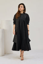 Black raw silk sleeveless midi dress with knee-length coat by Essence by Monika, front view