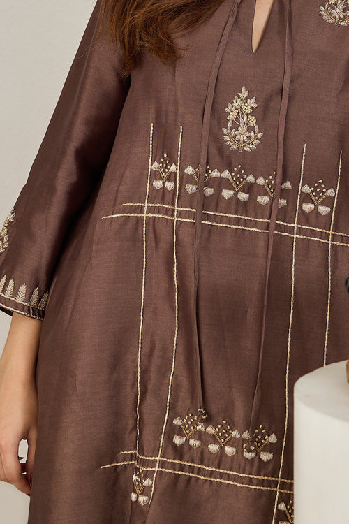 Close-up of the front dori tie with zari French-knot balls on a brown Chanderi kurta