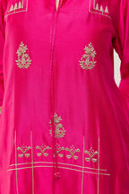 Close-up of hand dabka and zari embroidery on the front of a fuchsia Chanderi kurta