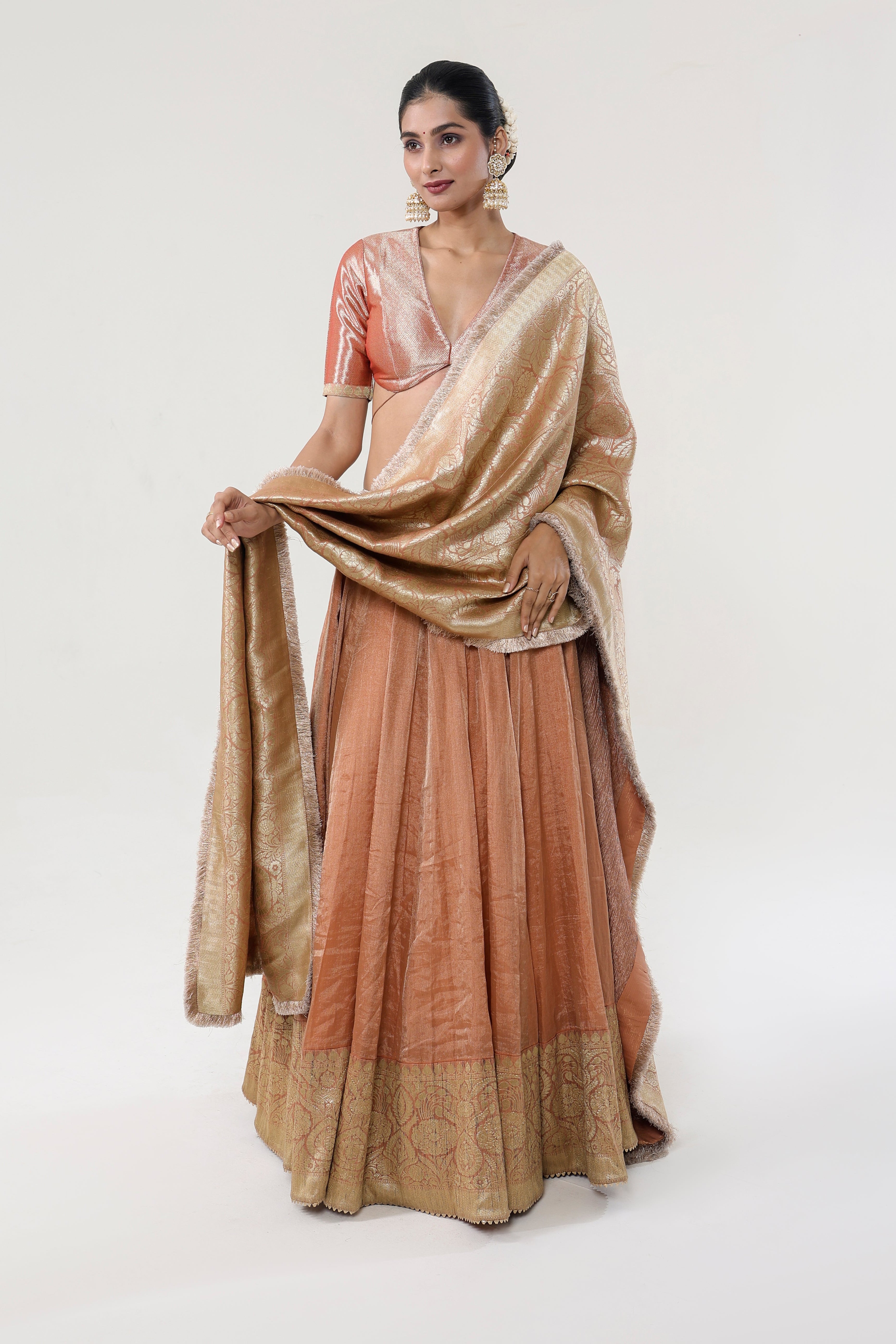 Peach Peach tissue + Banarasi silk + Banarasi Munga + Crushed Tissue Lehenga - front view | Essence by Monika
