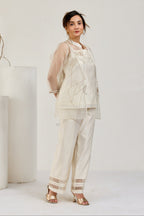 White Chanderi top and straight pants with hand-embroidered sheer organza jacket by Essence by Monika, front view