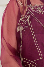 Close-up of hand jute and zari embroidery with seed beads on a wine organza jacket