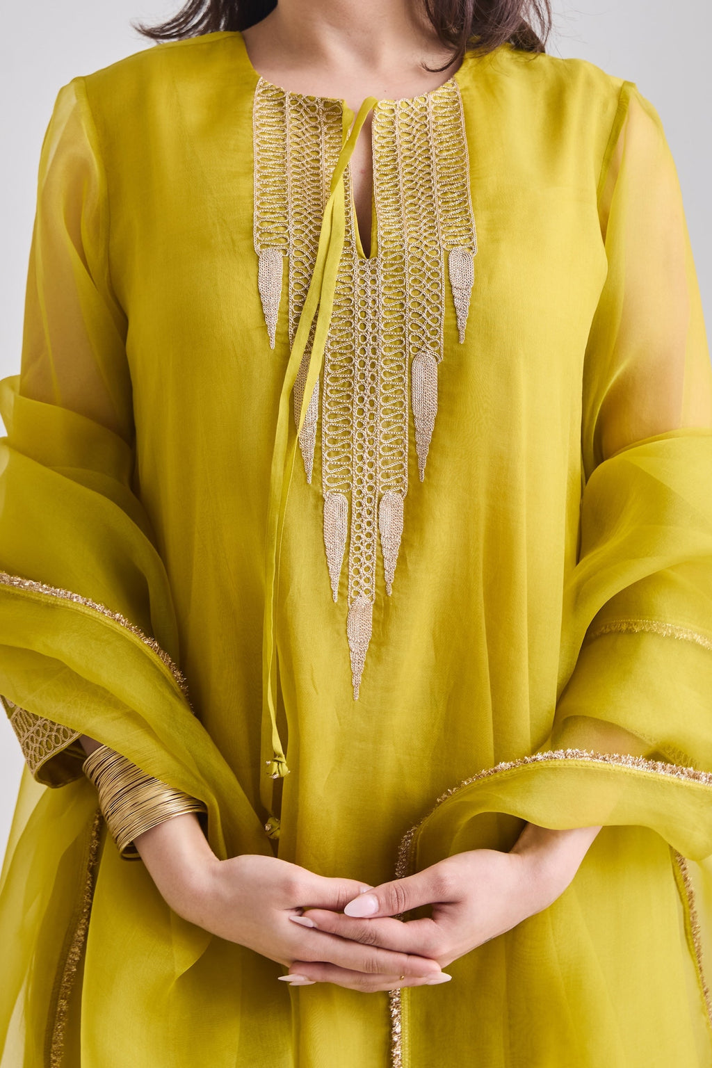 Gold temple motif zari embroidery on the neckline with French knot detail | Essence by Monika