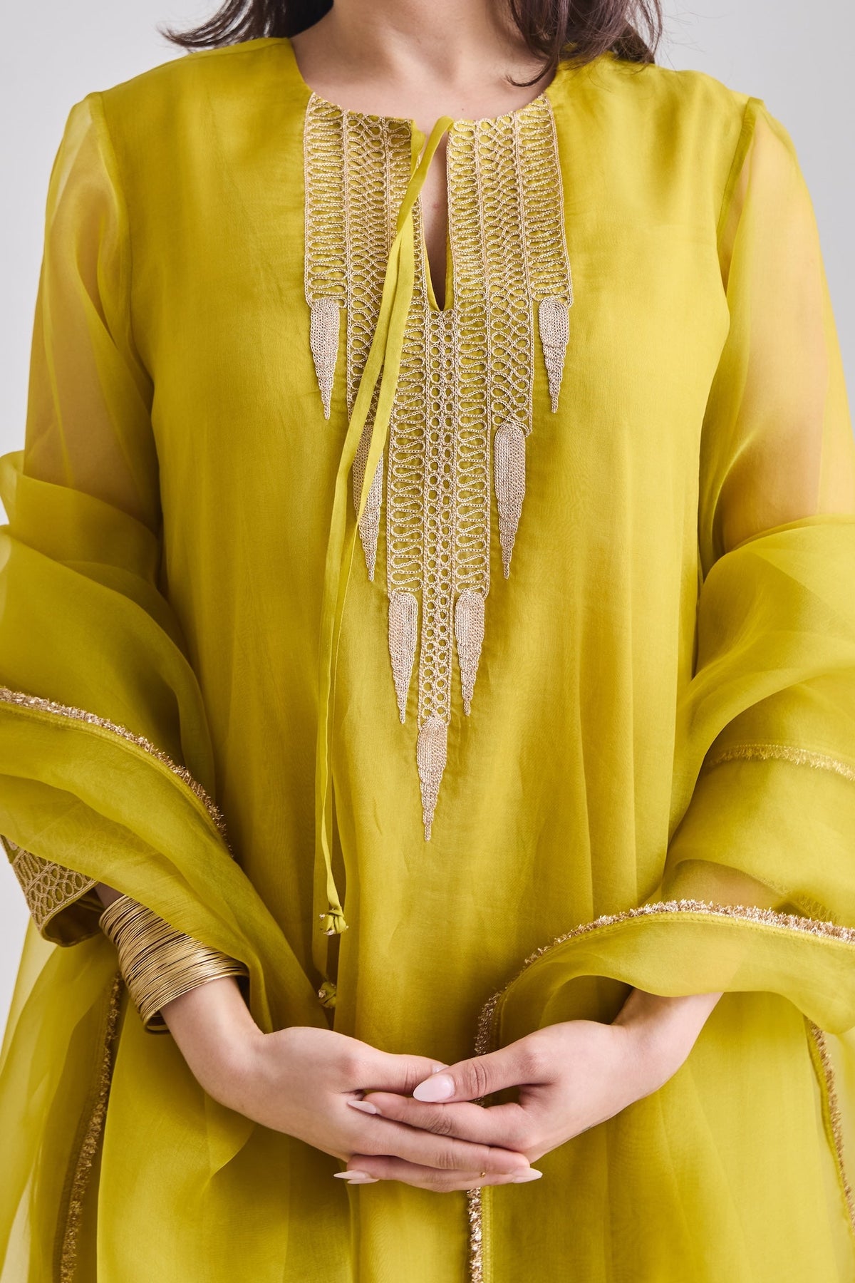 Gold temple motif zari embroidery on the neckline with French knot detail | Essence by Monika