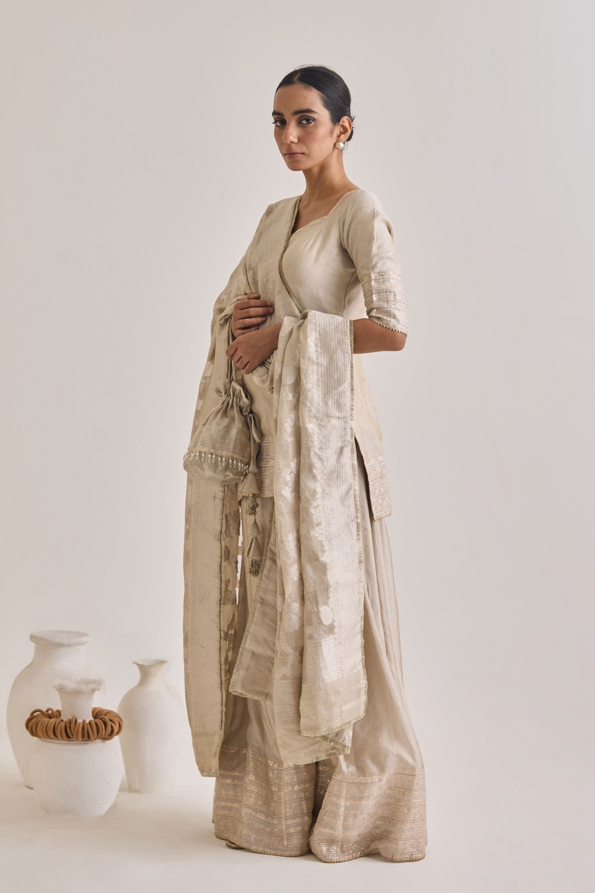 Side profile - wide flared sharara silhouette